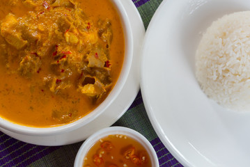 Khmer curry with chicken with a rice and chili sauce at 