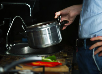 Man pours into the pan water