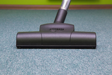 Professional vacuum cleaner turbo brush frees the carpet from dust. Early spring cleaning or regular clean up.