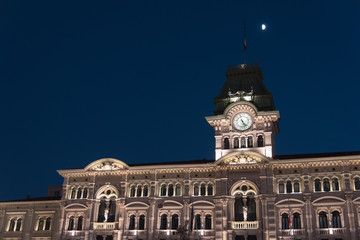 Reflections on the sea of Trieste at dusk - Historical buildings and lights
