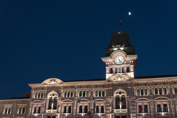 Reflections on the sea of Trieste at dusk - Historical buildings and lights