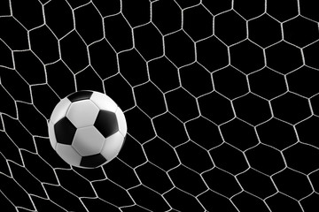 soccer ball in goal net isolated on black background