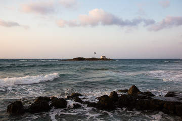 Rocks on the coast of Aegean Sea in Malia, Crete, Greece.