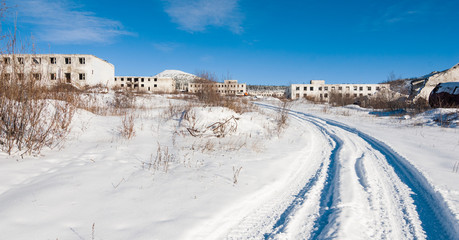 Fototapeta na wymiar Abandoned settlement winter view