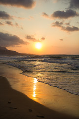Obraz premium Sunset at the sea coast. Malia, Crete, Greece.