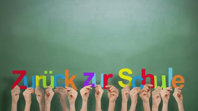 Hands holding up zuruck zur schule