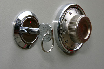 Combination lock on small home fire safe to protect documents and valuables from fire and burglary.