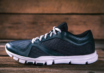running shoes on a wooden background. sport