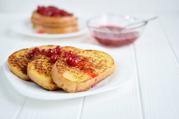 Homemade bread toast with berry jam  on a white background