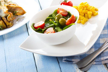 spinach tomato salad food fresh healthy cook rustic wooden background
