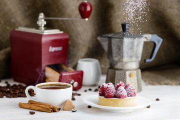 still life in rustic style, fresh tartlet with raspberries and h