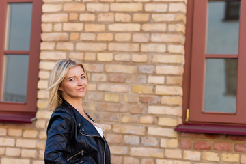 Portrait of a beautiful blonde in red pants