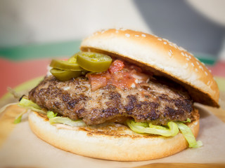freshly made hamburger on table with blurred background