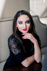 Portrait of a beautiful girl with long hair and makeup