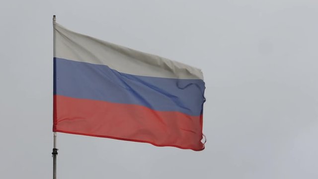 Flag of Russia waving in the srong wind