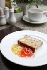 dessert baked or fruit bread on white dish.