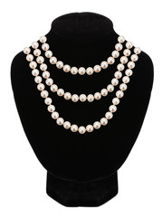 Pearl necklace on black mannequin isolated on white background