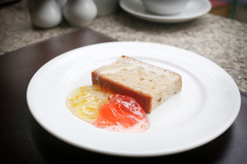 dessert baked or fruit bread on white dish.