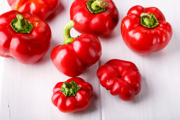 Tomato shaped sweet pepper on white.