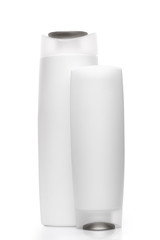 Two Shampoo bottles isolated on white background
