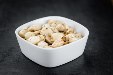 Portion of Garlic (preserved) on a slate slab