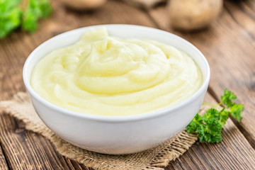 Mashed Potatoes (selective focus) on vintage wooden background