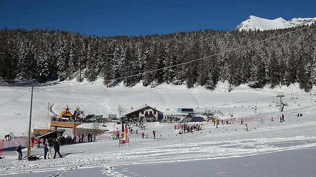 Brusson, Aosta Valley, Italy. January 15, 2017. Ski resort with skiers and ski lift