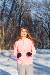 Happy young woman jogging