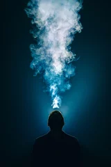 Poster The man smoke an electronic cigarette on the background of bright light © realstock1