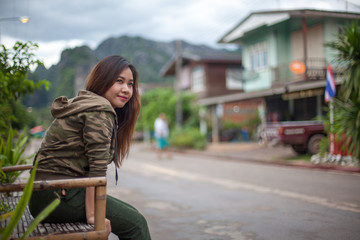 Portrait of beautiful asian young woman near the road