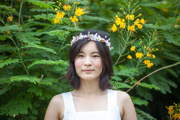 Young woman with a crown of flowers