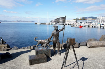Louis Bernacchi taking a self-portrait with his dog Joe, bronze statues tribute to the 1899 British...