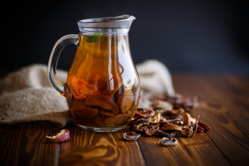 compote of dried fruits in a carafe - obrazy, fototapety, plakaty