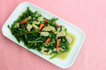 top view of stir fried water convolvulus with pork loin, thai style homemade food