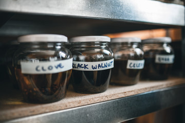 Different herb spices in glass jars