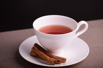 Acup of red tea with cinnamon
