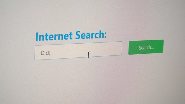 Internet user looking for an online dictionary using a search engine instead of a conventional dictionary in form of a book 