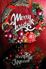Christmas wreath with the words Merry Christmas and mirrored.