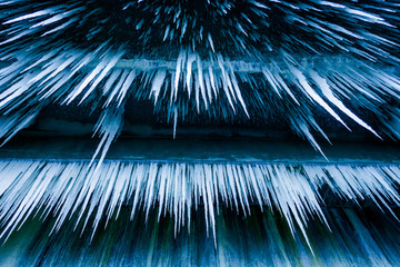 Lot of sharp and long icicles bottom view
