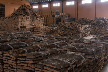 cork factory interior with many cork bales