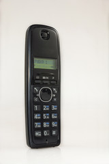 Handset radio telephone on a white table