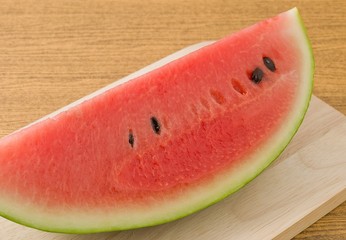 Red Ripe Watermelon on A Wooden Board