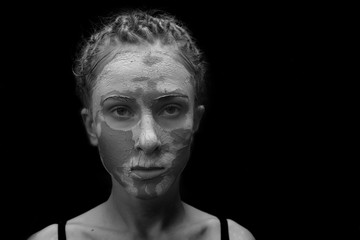 woman with facial mask,isolated on black