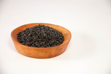 The sesame in wooden bowl. Black sesame.