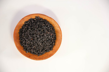 The sesame in wooden bowl. Black sesame.