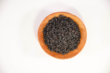 The sesame in wooden bowl. Black sesame.