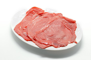Raw beef meat isolated on white background.