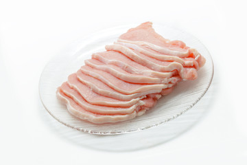 Pork slices on dish isolated in white background