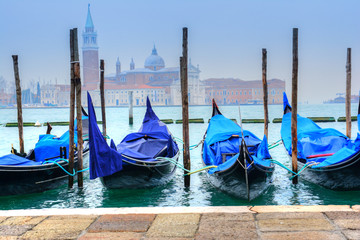 Santa Maria Cathedral and traditional gondola among tha Canal, Venice - Italy