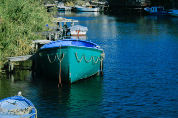 Turquois Boat Front View on River